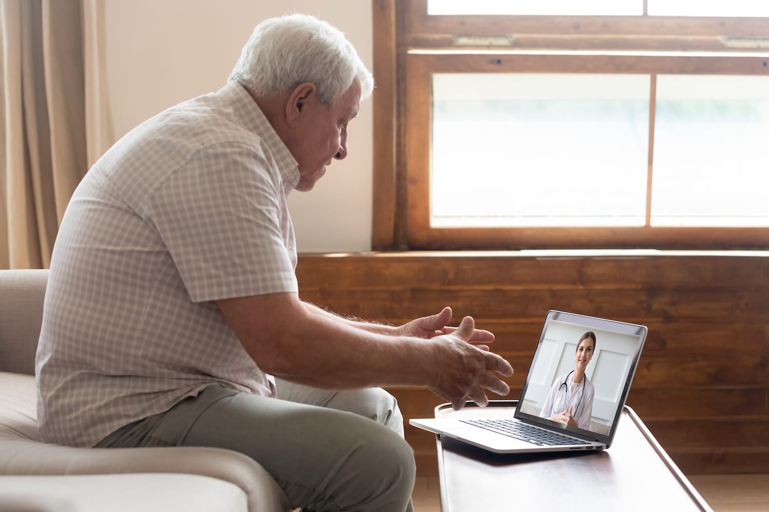 elderly man receives telehealth care