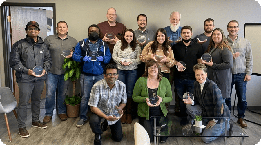 The Omcare team with awards