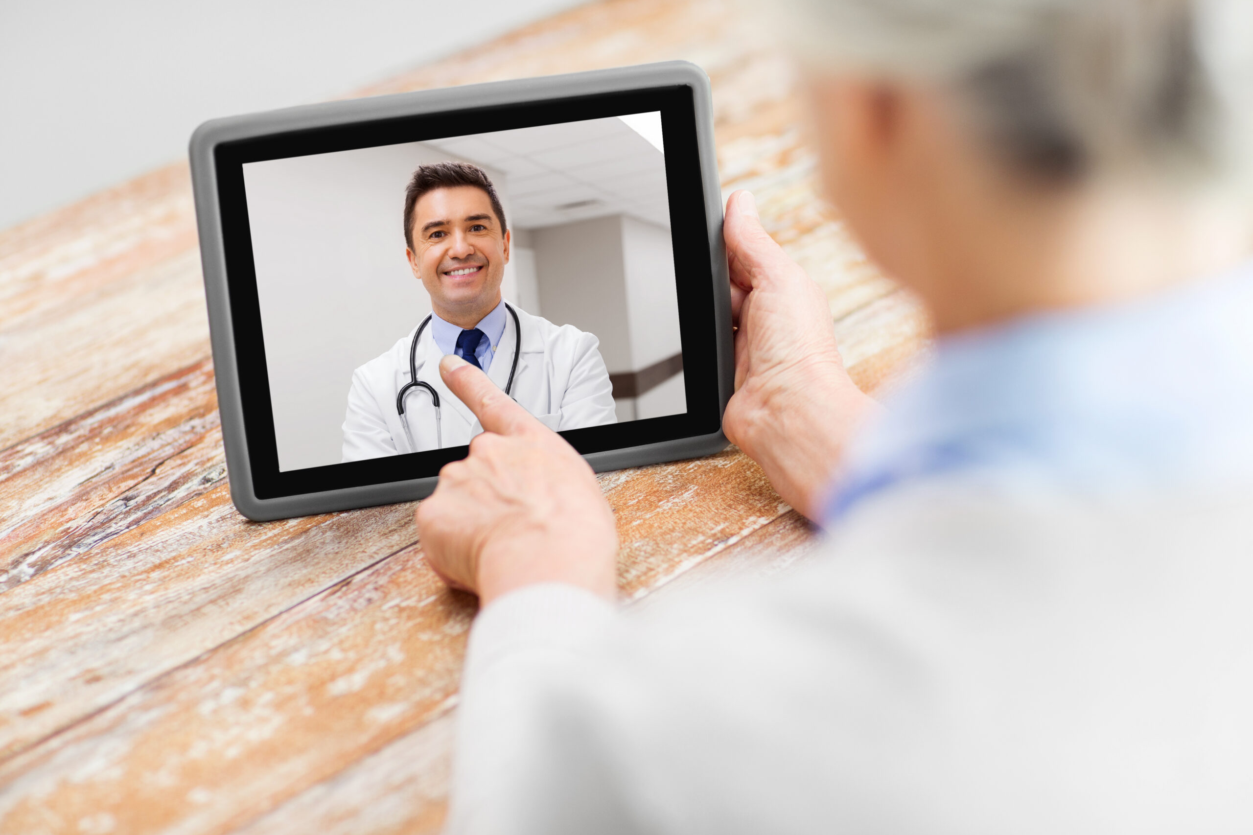 Senior woman patient having video call with doctor